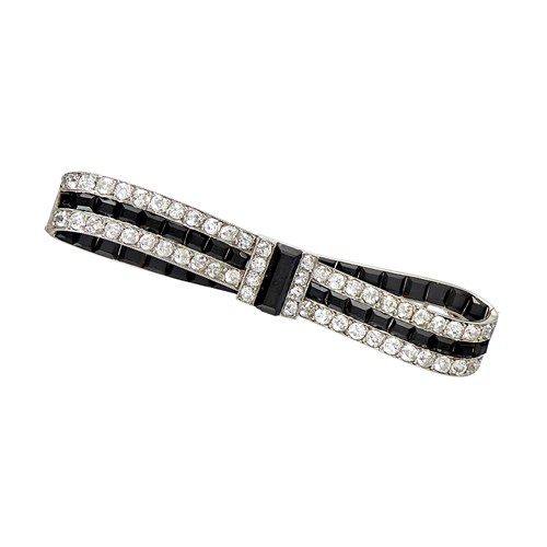 Art Deco diamond and onyx bow bar brooch by Cartier, Paris c.1920,